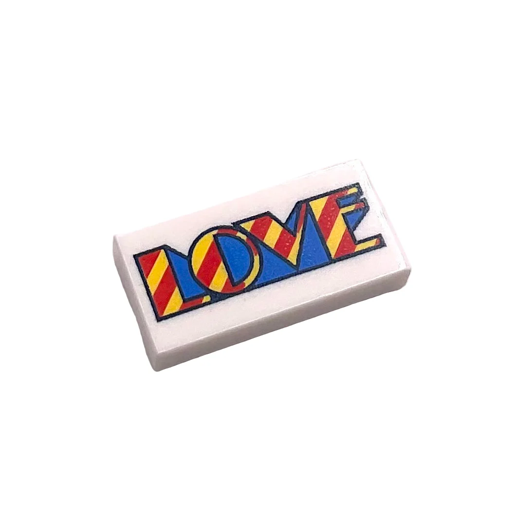 Tile 1 x 2 with Yellow, Red, and Blue 'LOVE' Pattern, Part# 3069pb0529